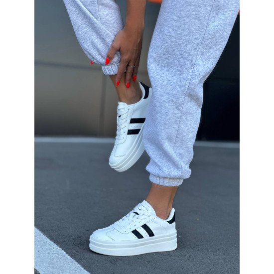 Кеди білі з чорними вставками