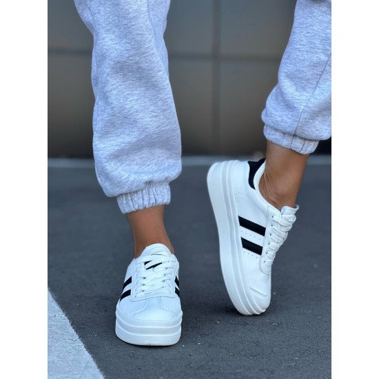 Кеди білі з чорними вставками